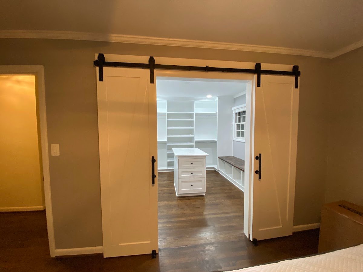 Custom walk-in closet with barn doors